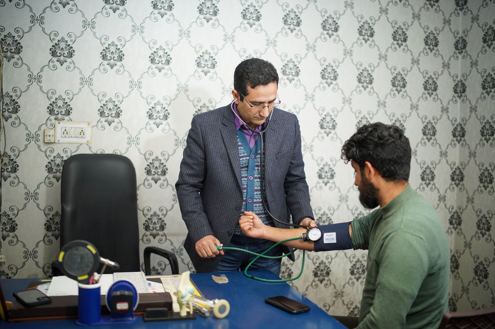 Doctor examining a patient in a consulting room