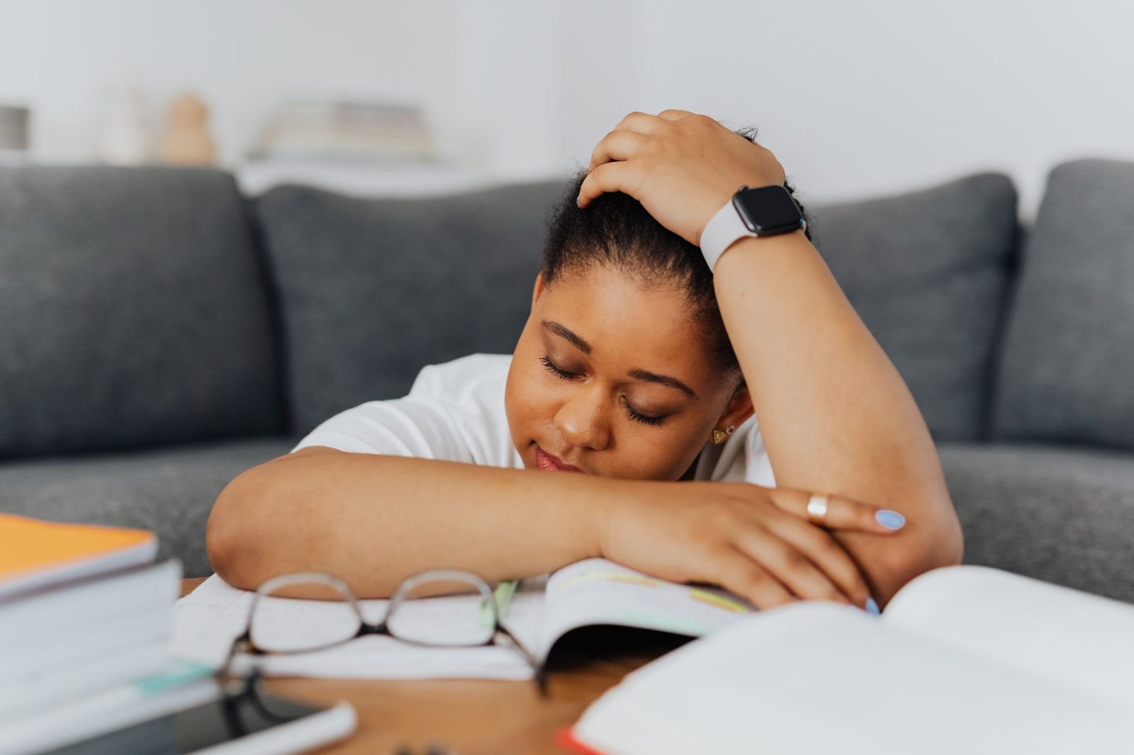 Exhausted woman resting her head on her hand